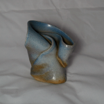 Stoneware swirl with light blue glossy glaze.